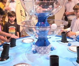 Visitors experimenting with airflow at the Bernoulli Fountain