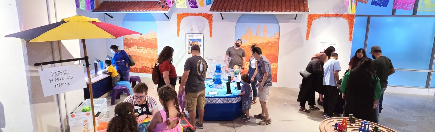 Families exploring the Mexican Plaza of Placita M&aacute;gica at National Children's Museum