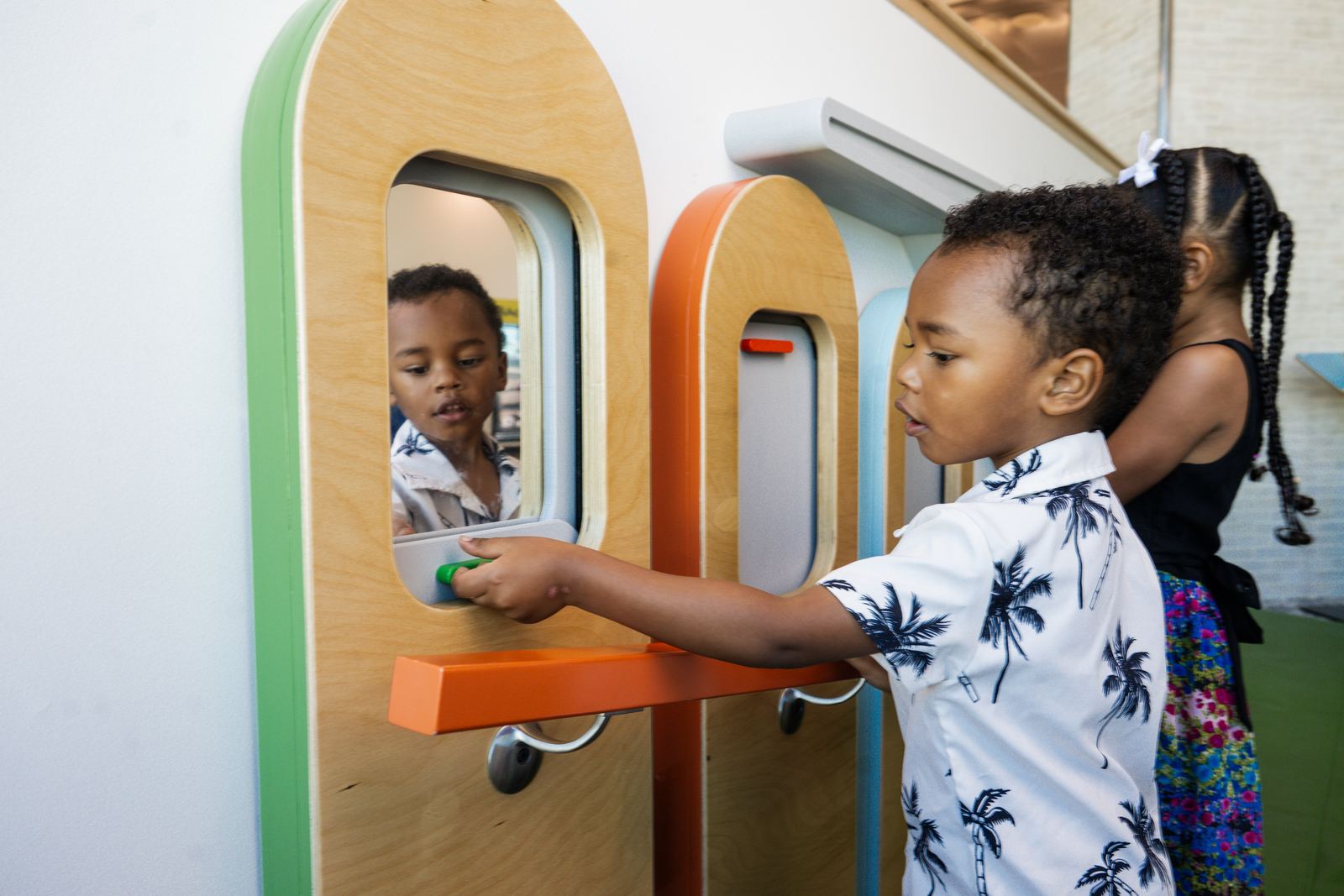Children at the aircraft window and mirror interactives