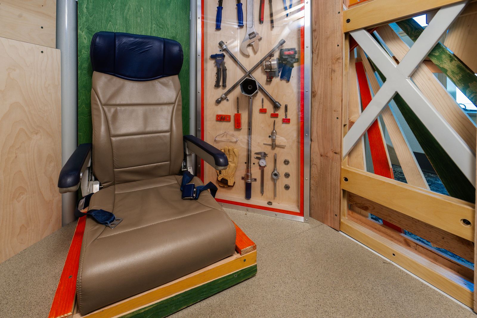 Aircraft seat and maintenance tool wall interactives