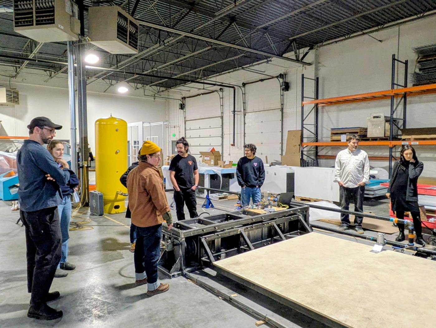 The whole crew gathered on the fabrication floor
